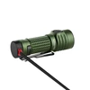 Green Olight Baton 3 Pro Max Turbo flashlight charging with magnetic cable