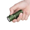 Hand pressing button on a green Olight Baton 3 Pro Max LED flashlight, a compact and powerful everyday carry light.