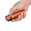 Handheld view of Baton 3 Pro Max in orange