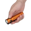 Olight Orange Baton 4 Pro held in hand with pocket clip, bright light for everyday carry.