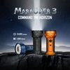 Olight Marauder 3 Black Orange and Blue Flashlights Casting Bright Beam on Rocky Ground for Outdoor Search and Rescue