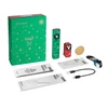 Olight holiday gift set with green Arkfeld and red Obulb flashlights, festive box, coin, manuals, and charging cables.