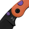 Halloween themed pocket knife featuring orange handle purple accents and black blade engraved with Trick or Treat