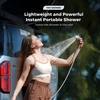 Woman using a Tiny Shower lightweight and powerful instant portable shower head for outdoor camping.