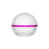 White sphere diffuser with a pink ribbon awareness band on a solid background