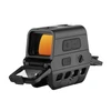 Tactical holographic red dot sight with orange reflective lens and protective flip-up cover on white background