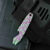 Olight Obuy Sheepdog Green and Purple Pry Bar Multi-tool Top View with Bottle Opener on Black Tactical Gear