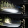Floodlight and spotlight comparison by a soldier at night in a forest clearing