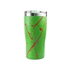 Lime green insulated travel tumbler with red splatter paint design and clear lid isolated on white background
