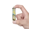 Olight Yellow Palm Tree i3E EOS Keychain Flashlight Held Between Two Fingers Showing Ultra Compact Size for Everyday Carry