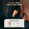 Compact orange Flextail outdoor gear hanging on a backpack highlighting its pocket-size lightweight design for travel