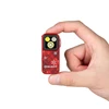 Hand holding a red Olight mini flashlight with Christmas plaid pattern and white snowflakes.