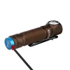 Olight brown right-angle flashlight charging with magnetic blue USB cable isolated on white background