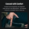 Olight Black Osight SE firearm attached to belt for comfortable concealed carry or duty use.