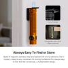 Olight Orange Baton 4 Pro flashlight magnetically mounted on wall bracket for easy storage and access