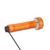 Orange Olight Prowess flashlight with knurled handle connected to magnetic charging cable isolated on white background