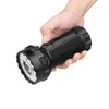 Olight Black Marauder 3 Flashlight Held in Hand with Textured Grip and Rotary Switch for Search and Rescue Use