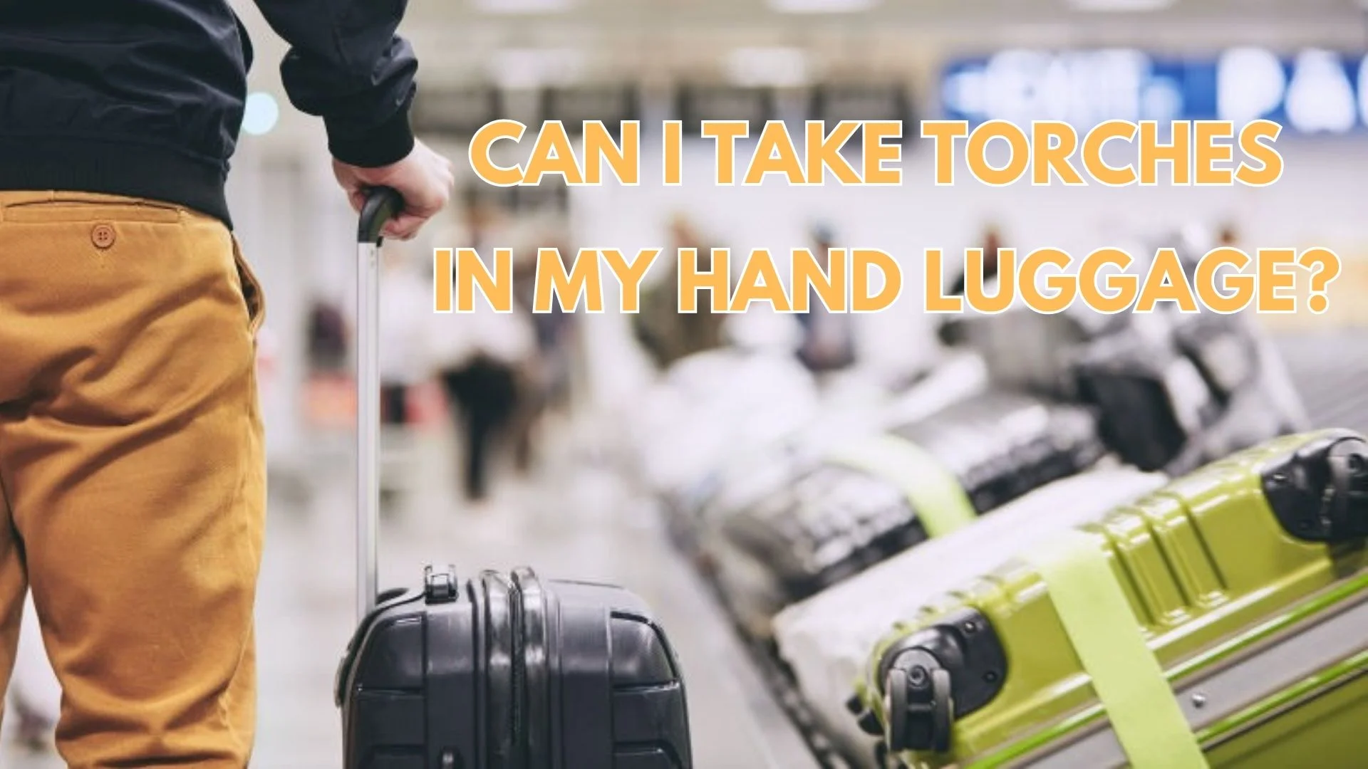 Traveler with suitcase at airport, questioning if torches are allowed in hand luggage.