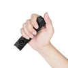 Hand holding a compact black EDC flat flashlight, demonstrating its portable size and ergonomic grip on a white background