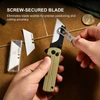 Using mini wrench tool to tighten screw secured blade on gold folding utility knife for precise cutting accuracy