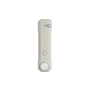 Sleek rectangular tan tactical flashlight with round LED bulb and metallic buttons isolated on white background