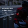 Olight White Oclip Pro with Red Blinking Light on a Cyclist's Arm for Emergency Visibility