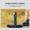 Olight Dark Teal Right-Angle Flashlight Headlamp with textured body, magnetically charging on a power bank for versatile outdoor illumination.