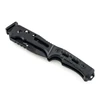 Black tactical folding knife with a textured grip handle on a white background