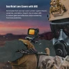 Tactical holographic sight with sacrificial lens covers and ARD mounted on a rifle held by a soldier in a gas mask