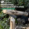HX Outdoors DC53 steel professional survival knife being used to split wood outdoors.