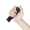 Hand holding a compact black EDC flashlight showing its portable size and rotary switch.