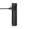 Black Olight Arkfeld Pro flat flashlight charging via USB-C cable against a white background
