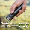 Olight Grey Seeker 4 Pro Flashlight in Hand close-up showing textured grip and 4600 lumens power for outdoor search and rescue