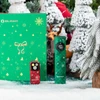 Olight Christmas special edition green and red flashlights with snowflake designs next to a festive gift box on snow.